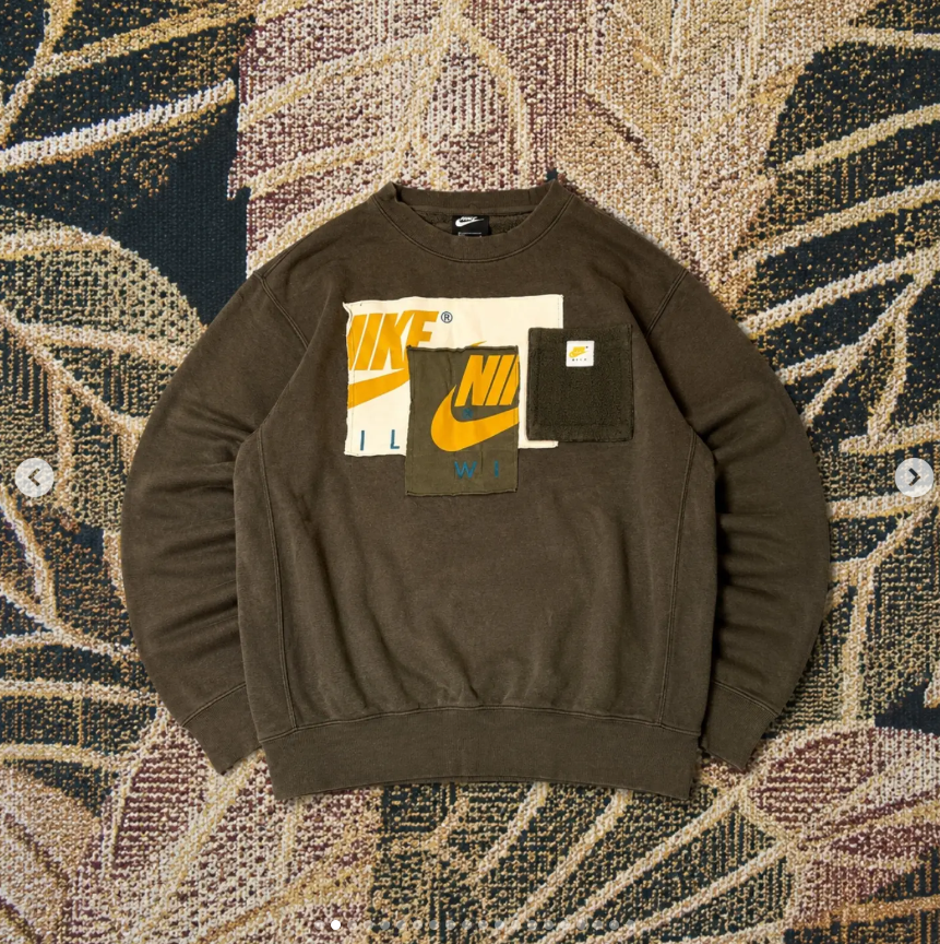 Brown Nike patchwork sweatshirt on a patterned textile