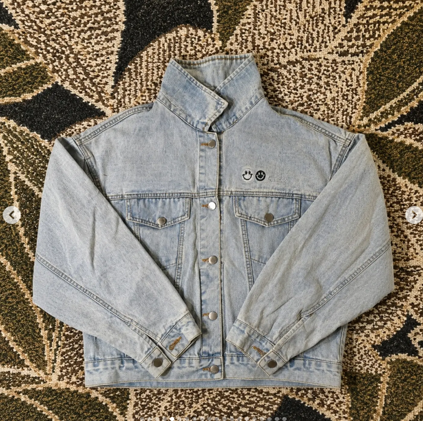 Light wash denim jacket on a patterned textile
